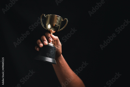 Businessman, success, company president Holding an outstanding trophy for corporate development of an investment company 