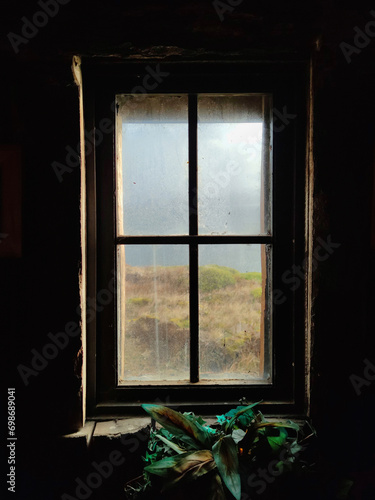 View through a window in the chapel 'Capilla Stella Maris' at Cape Horn, Tierra del Fuego, Chile
 photo