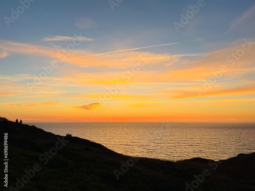 Ocean and purple sky at the ocean bay, orange ocean horizon photo