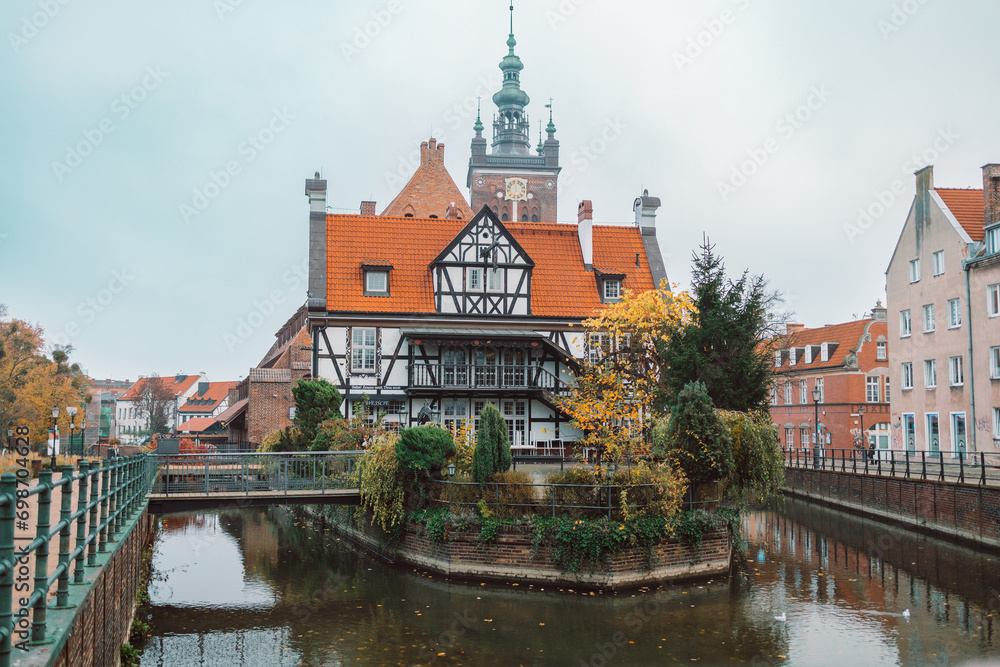 View from the front of the Millers' Guild house and the Radunia Canal in Gdansk, Poland on a blue sky summer day. High quality photo View from the front of the Millers' Guild house and the Radunia Canal in Gdansk, Poland on a blue sky summer day. High quality photo