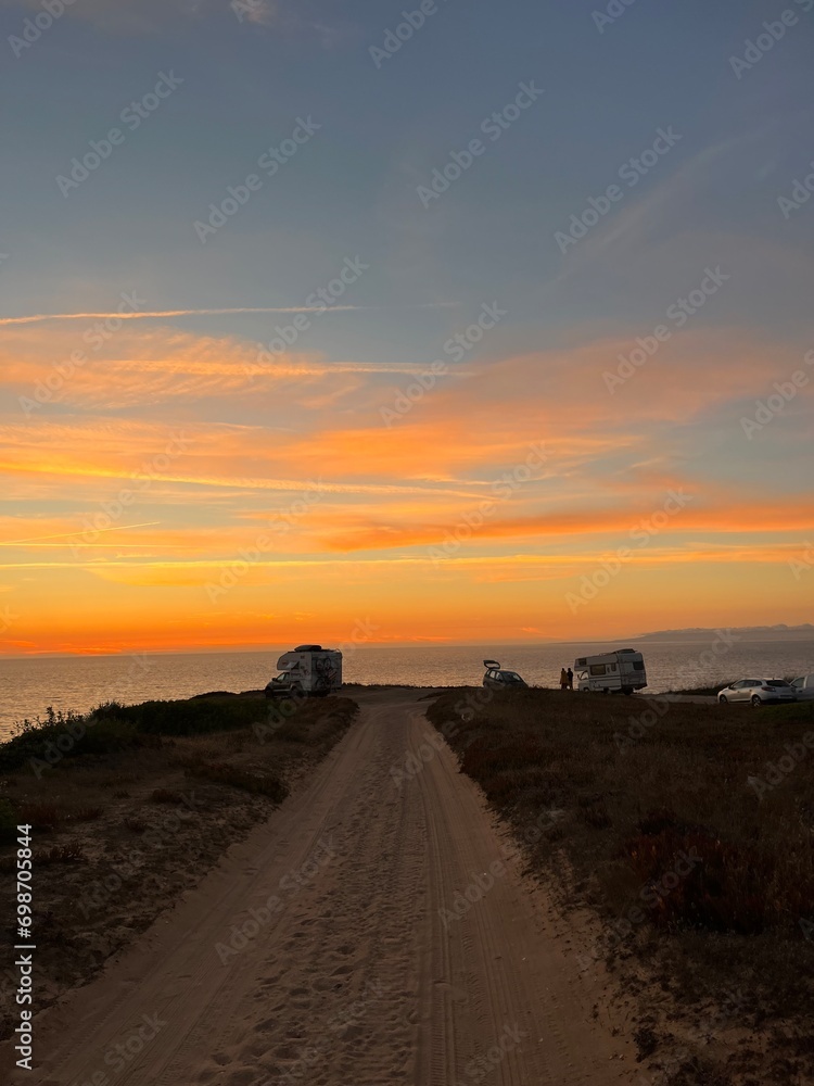 Fototapeta premium Ocean and purple sky at the ocean bay, orange ocean horizon