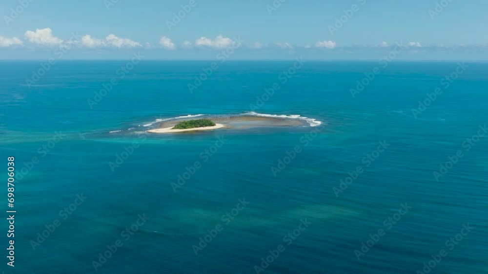 Beautiful Jobo Island surrounded by white sand. Blue sea under blue sky. Surigao del Sur, Philippines. Beautiful Jobo Island surrounded by white sand. Blue sea under blue sky. Surigao del Sur, Philippines.