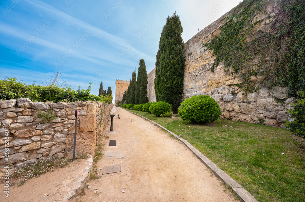 A view of Archaeological Walk, with monumental roman walls, in Tarragona, Spain. High quality photography A view of Archaeological Walk, with monumental roman walls, in Tarragona, Spain. High quality photography