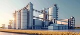 Agro-processing and manufacturing plant with silver silos for agricultural product processing, drying, cleaning, storage, including flour, cereals, and grain. Also includes a granary elevator.
