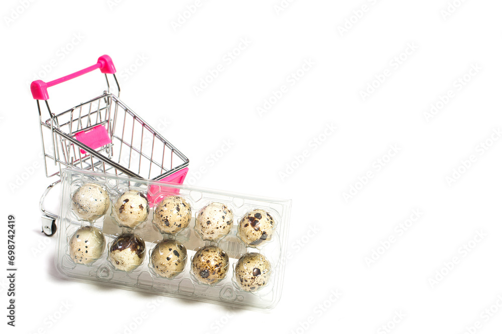 Quail eggs on a white background in a shopping cart, dietary eggs