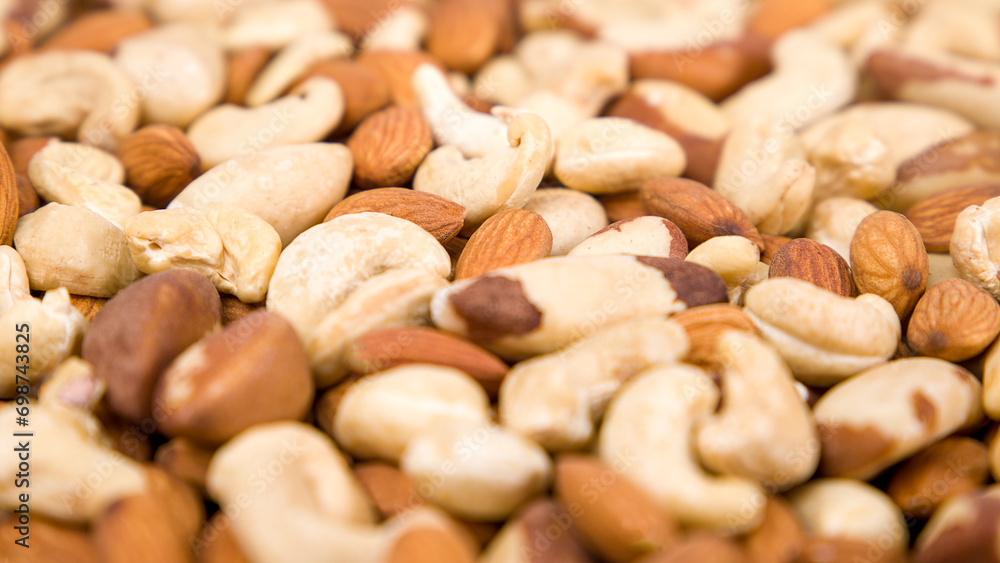 Background of nuts, almonds, cashews, Brazil nuts. Selective focus.