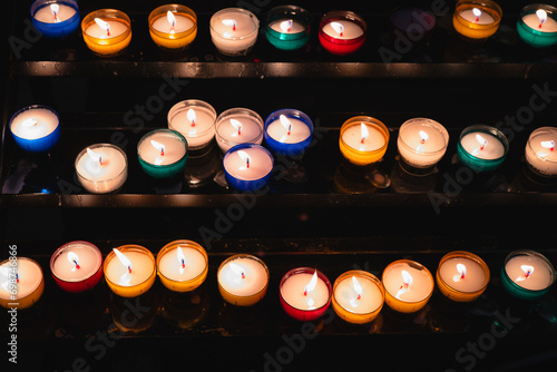 Illuminated votive candles in Bayonne church photo