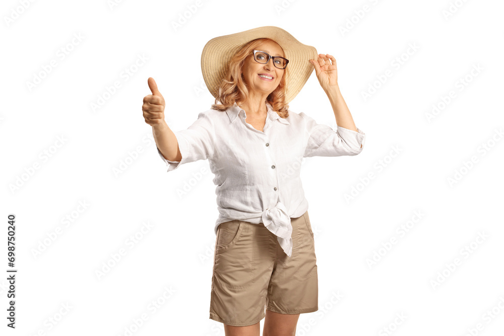 Woman with a straw hat gesturing thumbs up Woman with a straw hat gesturing thumbs up