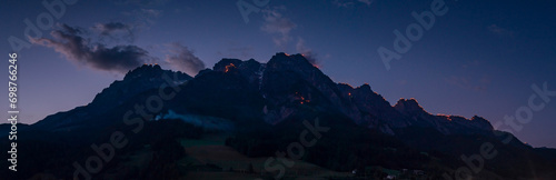 During the Johanni festival, a Christian tradition, people celebrate on the mountain peaks of Wilder Kaiser by enlighting big fires in Austria during July..