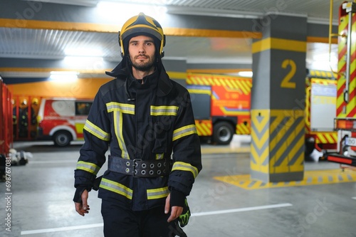 Portrait of male firefighter in uniform at fire station