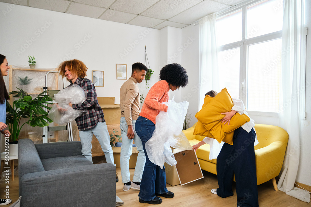 Group of students moving in a student residence at the university. New apartment relocation.
