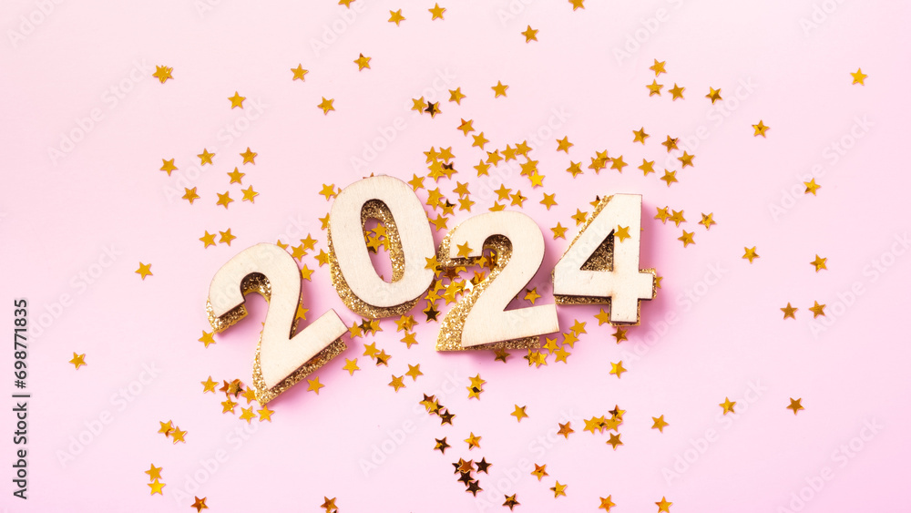 Numbers 2024 and stars on a pink background. Happy new year concept Numbers 2024 and stars on a pink background. Happy new year concept