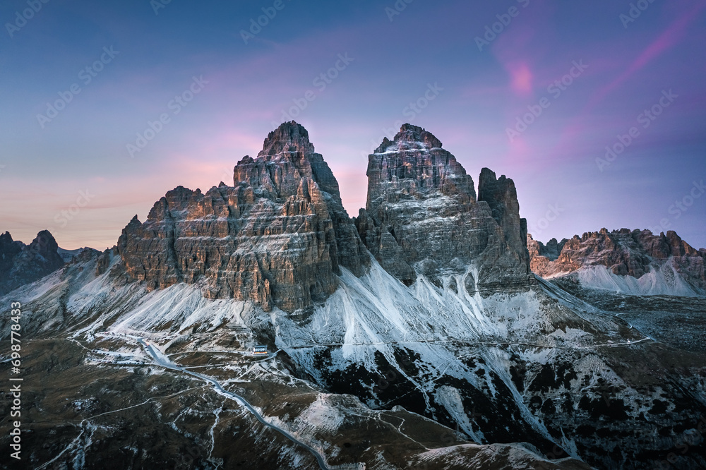 Stunning sunset with colorful sky at Italian Dolomites. Impressive Cadini di Misurina mountain range in autumn colors.