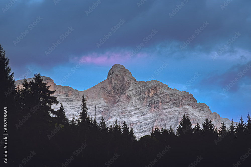 Stunning Italian Dolomites in vibrant colors. Picturesque Alpine mountain range at summer time.