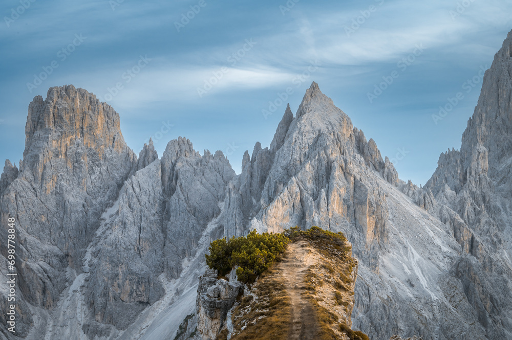 Stunning sunset with colorful sky at Italian Dolomites. Impressive Cadini di Misurina mountain range in autumn colors.