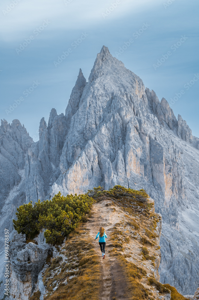 Stunning sunset with colorful sky at Italian Dolomites. Impressive Cadini di Misurina mountain range in autumn colors.