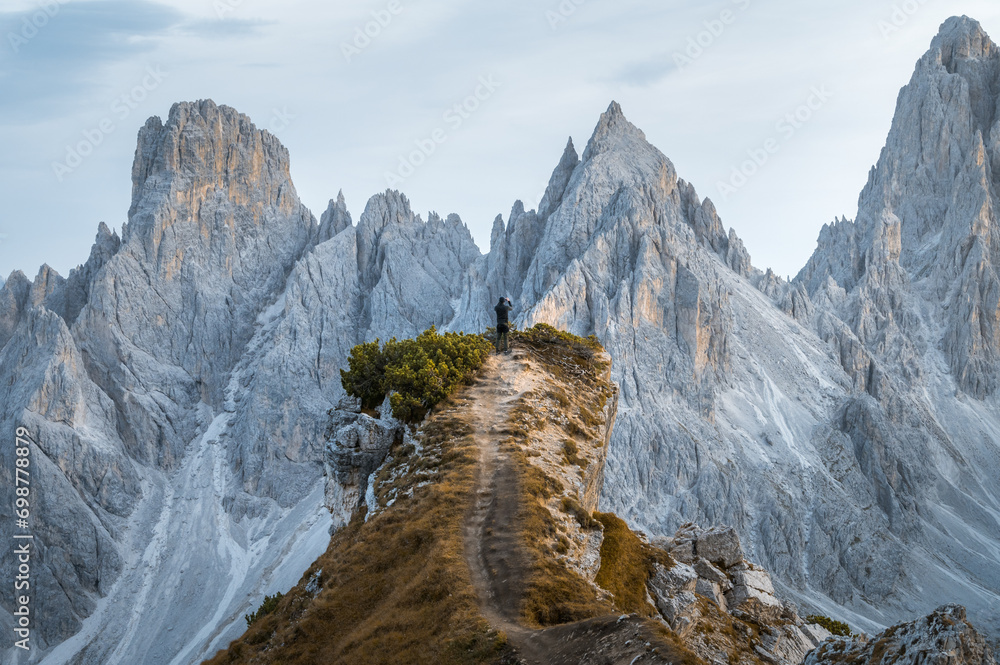 Stunning sunset with colorful sky at Italian Dolomites. Impressive Cadini di Misurina mountain range in autumn colors.