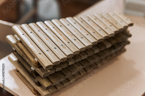 A lot of wooden xylophones, musical instruments lie on the table. Photography, music concept for children.