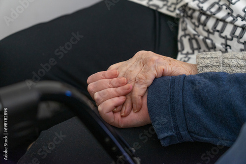Photography Hand of an older woman holding the hand of another woman