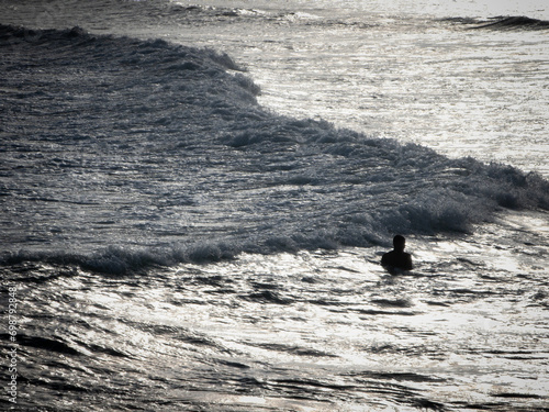 Surfer on board waiting for the next wave