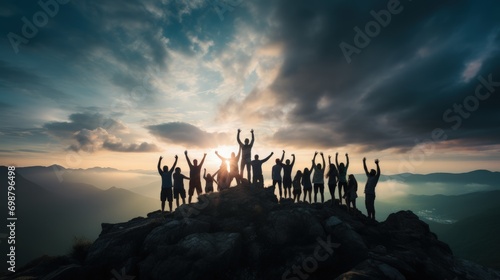 Peak triumph: silhouettes a top mountain, joyous group celebrates team success , embodying shared victories, harmonious collaboration, euphoria of collective achievement in nature's majestic embrace.