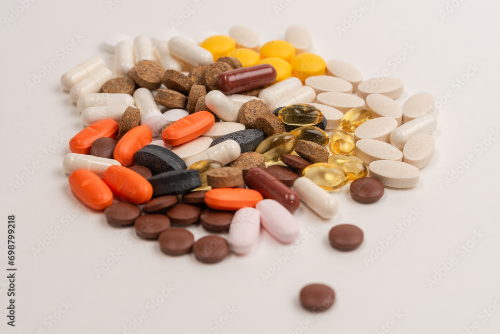 Background with medicines, large amount of pills,Painkiller pills pile. Pharmacy, Tablets stacked Background with medicines, large amount of pills,Painkiller pills pile. Pharmacy, Tablets stacked