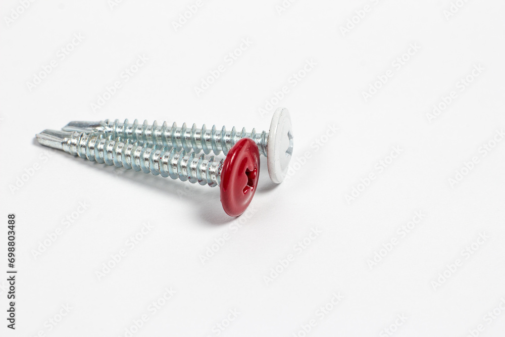 Self-tapping screws for construction on a white background Self-tapping screws for construction on a white background