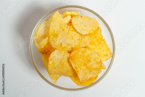 Crispy and salty chips on a white background