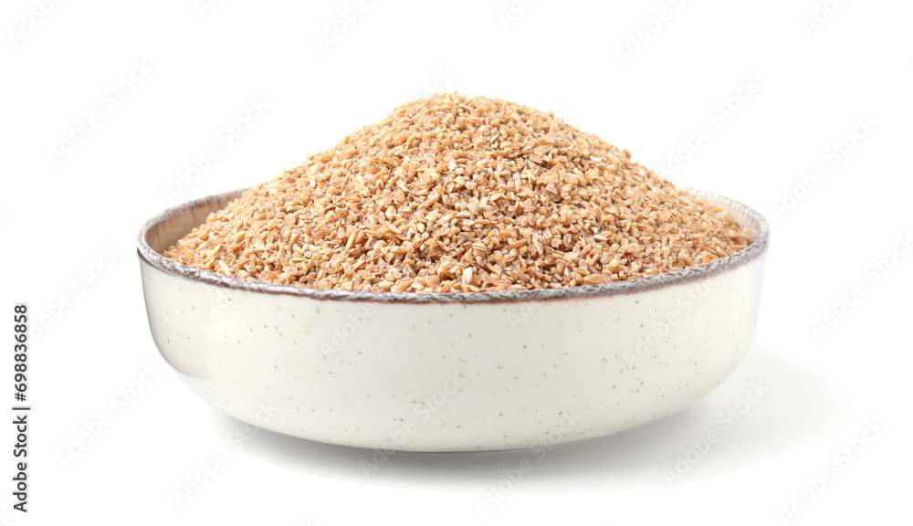 Dry wheat groats in bowl isolated on white Dry wheat groats in bowl isolated on white