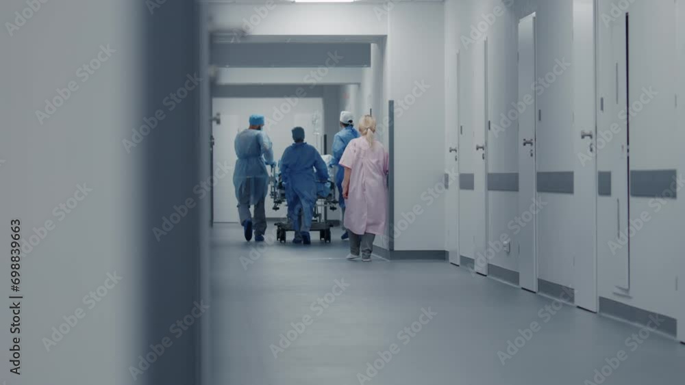 Physicals, nurses and paramedics move stretcher with patient toward operation room. Seriously sick patient lies on gurney with medical drip. Medical personnel in emergency department. Slow motion. Physicals, nurses and paramedics move stretcher with patient toward operation room. Seriously sick patient lies on gurney with medical drip. Medical personnel in emergency department. Slow motion.