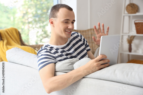 Young man using tablet comp...