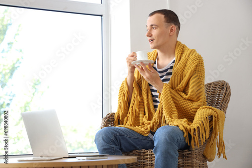 Young man with plaid and cu...