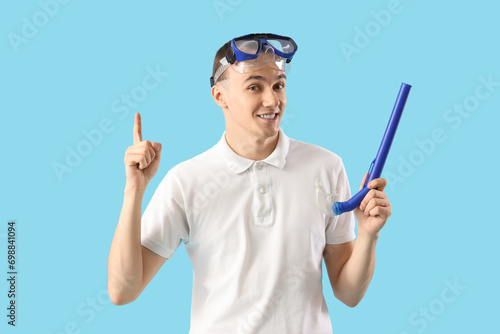 Young man with snorkeling m...
