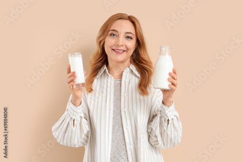 Mature woman with bottle an...