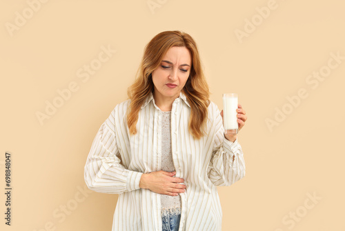 Mature woman with glass of ...