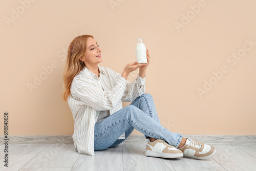 Mature woman with glass of ...