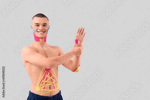Young man with physio tape ...