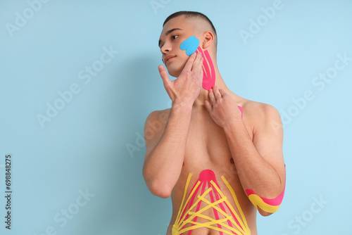 Young man with physio tape ...