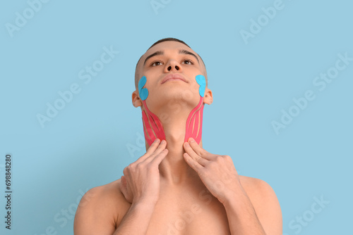 Young man with physio tape ...