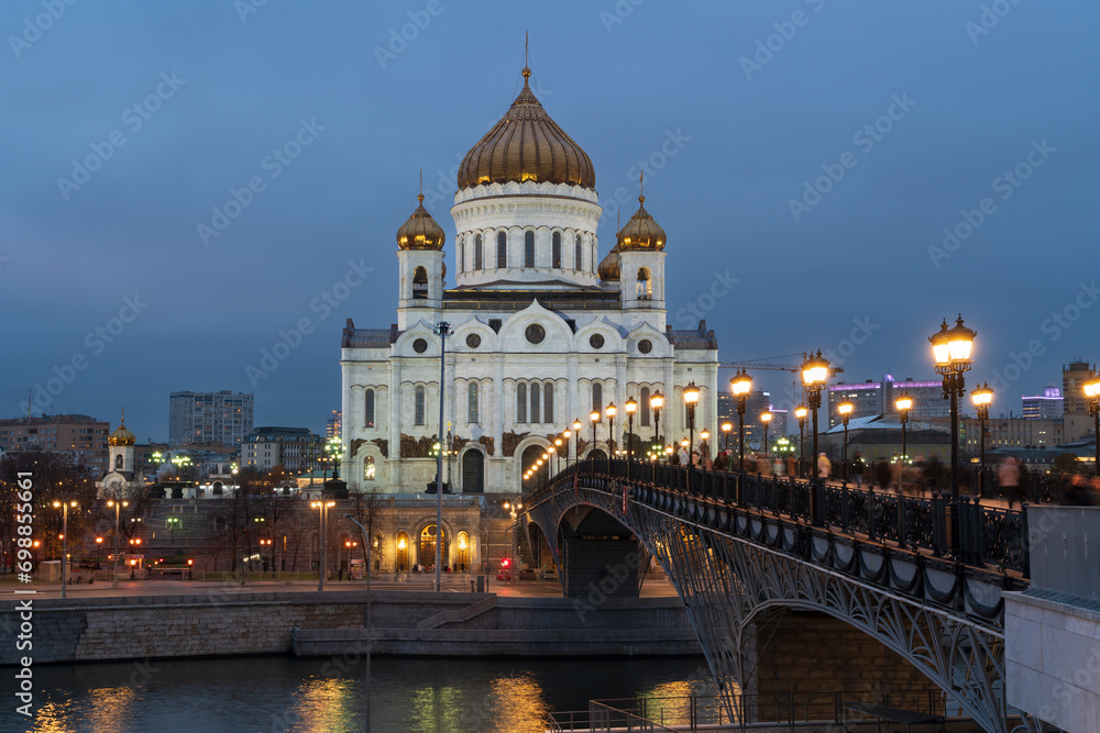 View of the Cathedral of Christ the Savior and the Patriarchal Bridge from the Beresnevskaya embankment of the Moskva River at night, Moscow, Russia