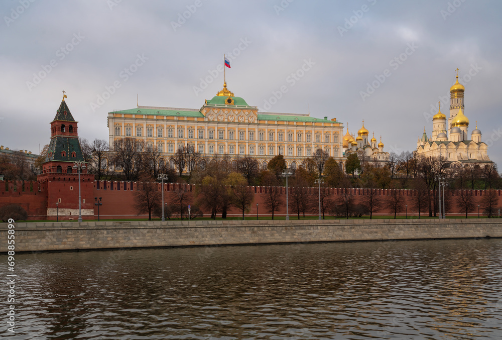 View of the building of the Grand Kremlin Palace, the Annunciation Tower and the ensemble of the Kremlin Cathedral Square from the embankment of the Moskva River, Moscow, Russia