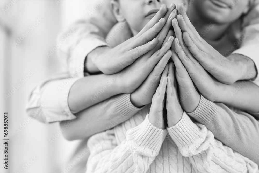 Family praying together at home, closeup - obrazy, fototapety, plakaty 