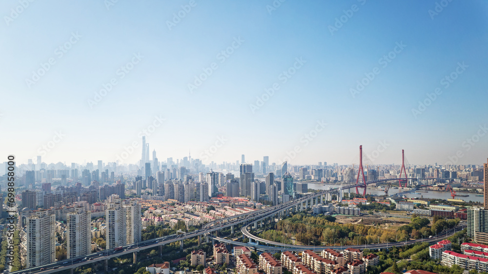 Aerial view of Shanghai skyline and cityscape with blue sky background, China.