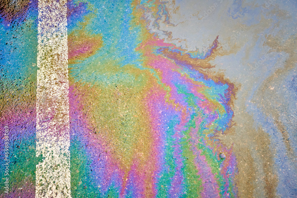 Gas Puddle on Parking Lot Dividing Line Close Up Abstract