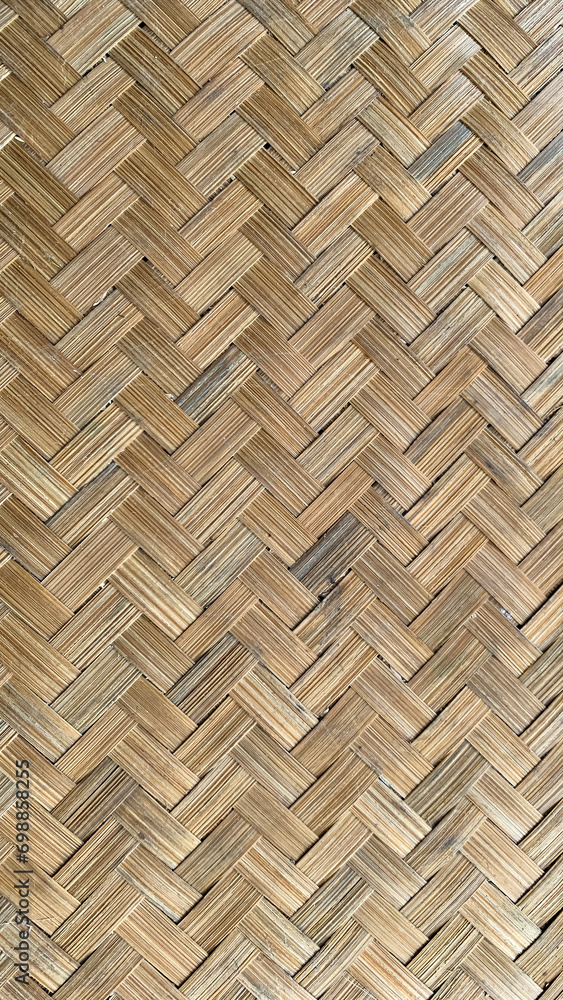 Woven bamboo wall background natural texture pattern indonesian style. Bamboo basket mat seamless pattern. Top view. Woven bamboo wall background natural texture pattern indonesian style. Bamboo basket mat seamless pattern. Top view.