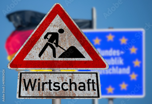 Flagge von Deutschland und Schild Baustelle Wirtschaft