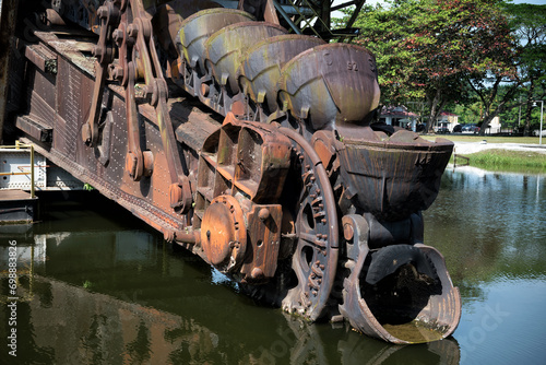 The last abandoned tin mining dredger during British colonial now display in Tanjung Tualang, Batu Gajah, Perak, Malaysia photo