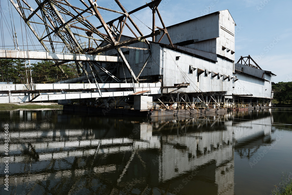 The last abandoned tin mining dredger during British colonial now display in Tanjung Tualang, Batu Gajah, Perak, Malaysia