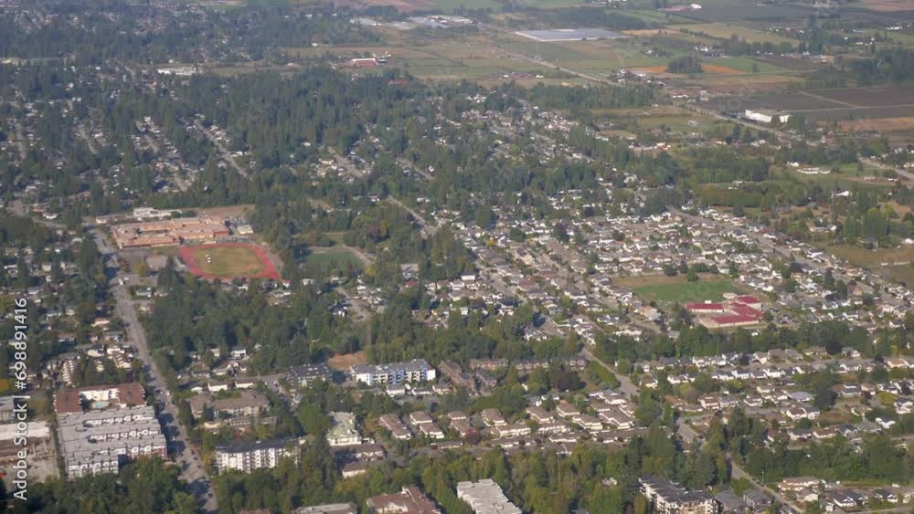 Passenger View Overflying an Urban Area on a Sunny Day Passenger View Overflying an Urban Area on a Sunny Day