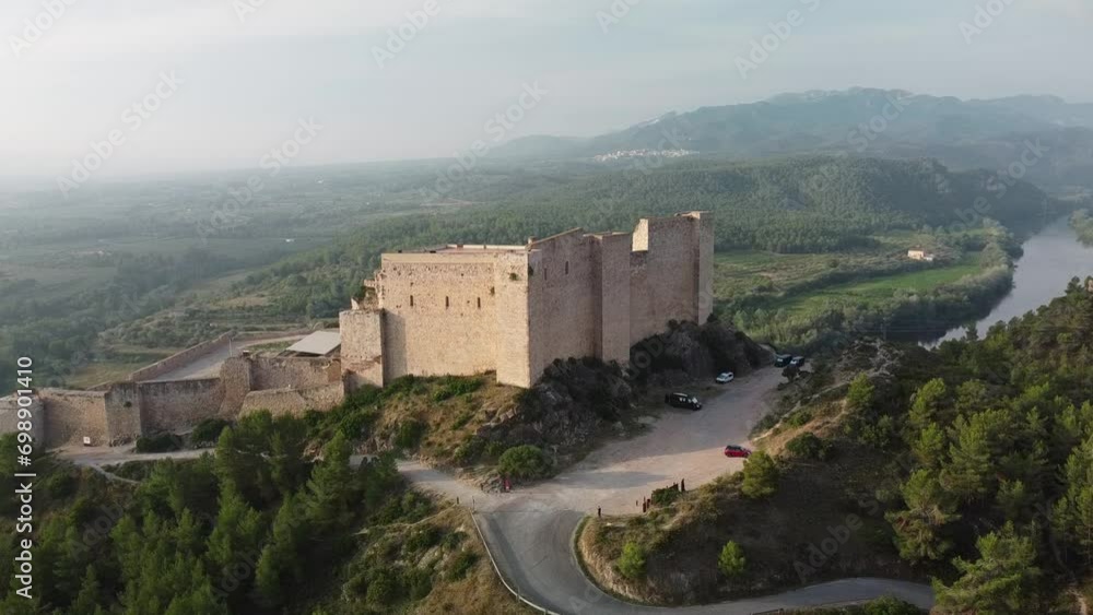 Miravet Castle on a foggy morning. Tarragona, Catalonia. Aerial 4k view Miravet Castle on a foggy morning. Tarragona, Catalonia. Aerial 4k view